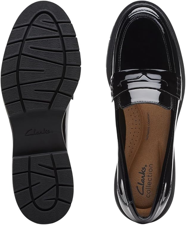 Top view and sole of a black patent leather loafer by Clarks, showcasing its design and comfort features.